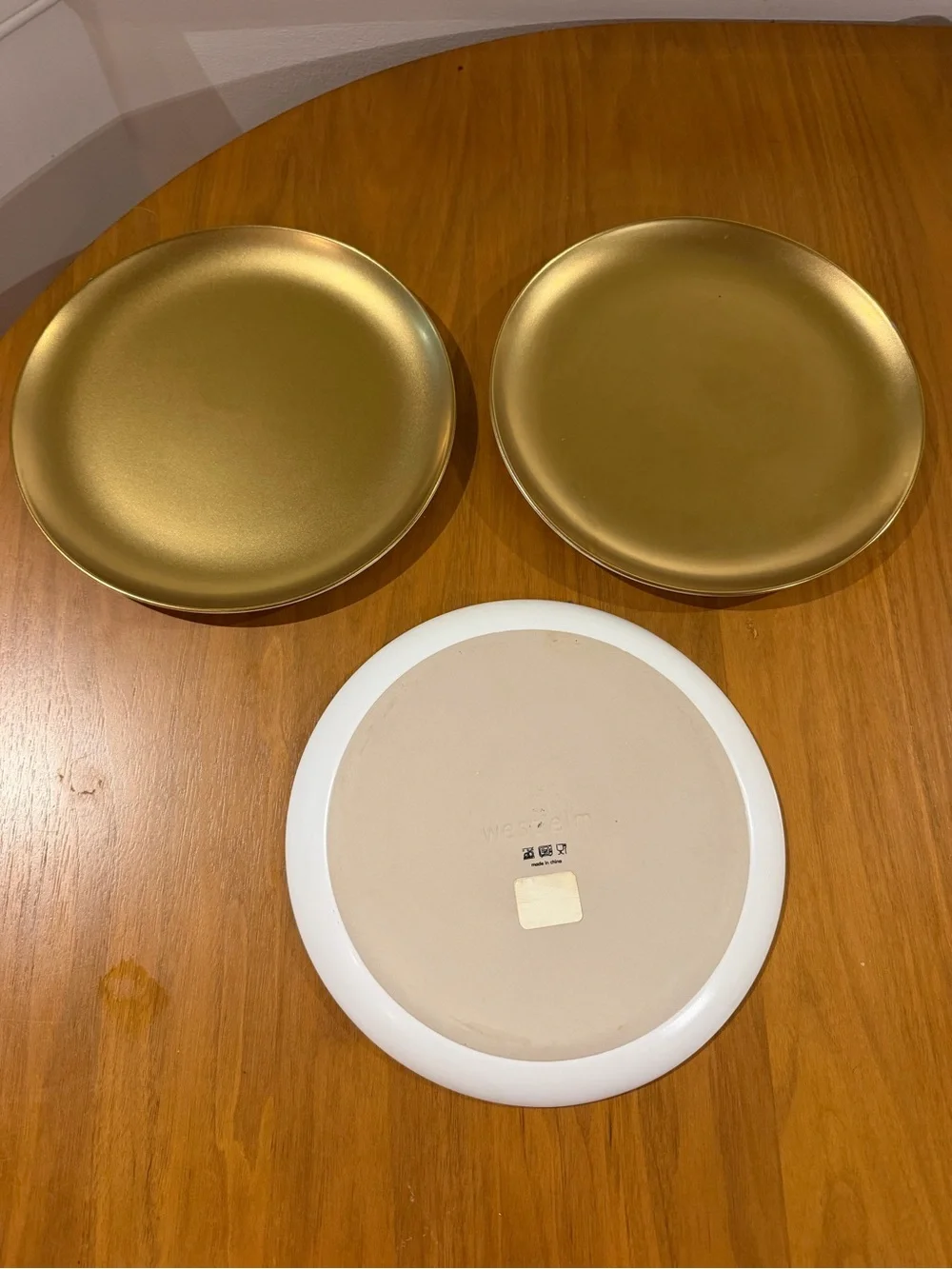 Set of three gold West Elm Plates